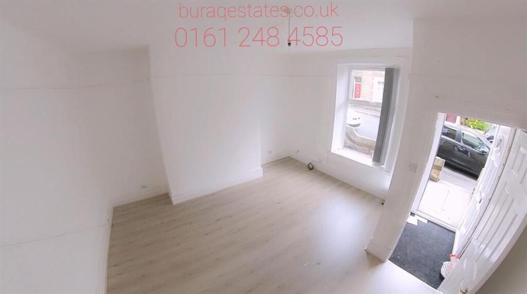 Bright and clean hallway featuring light wood f...