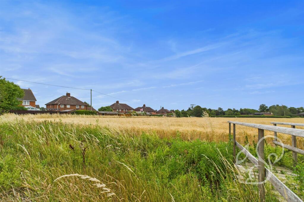View of field looking towards back of property