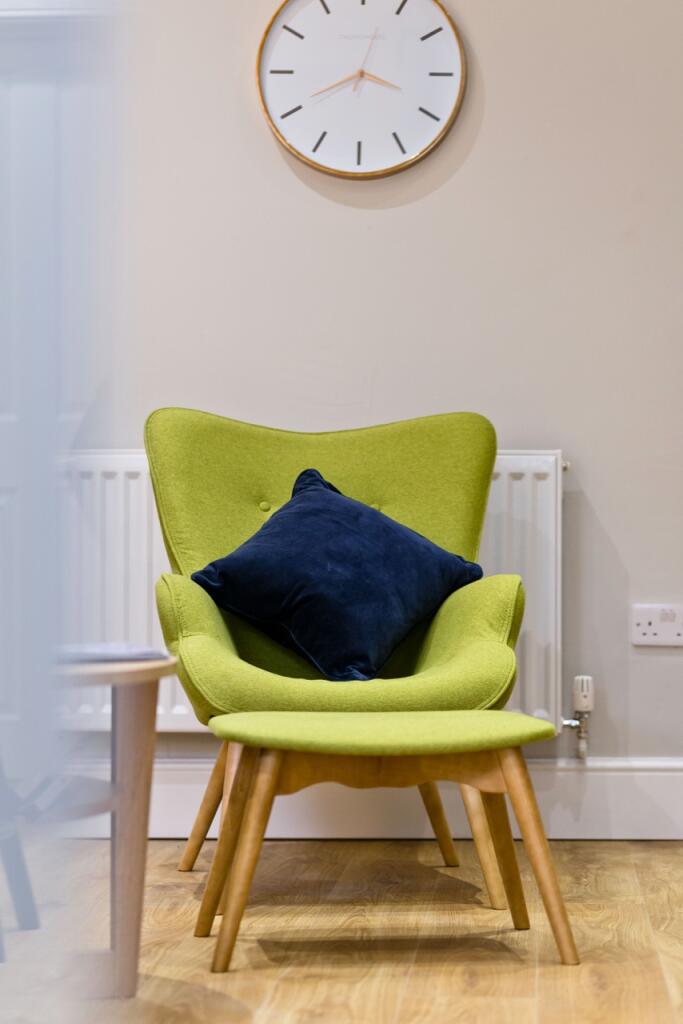 A bright and stylish living room featuring a vi...