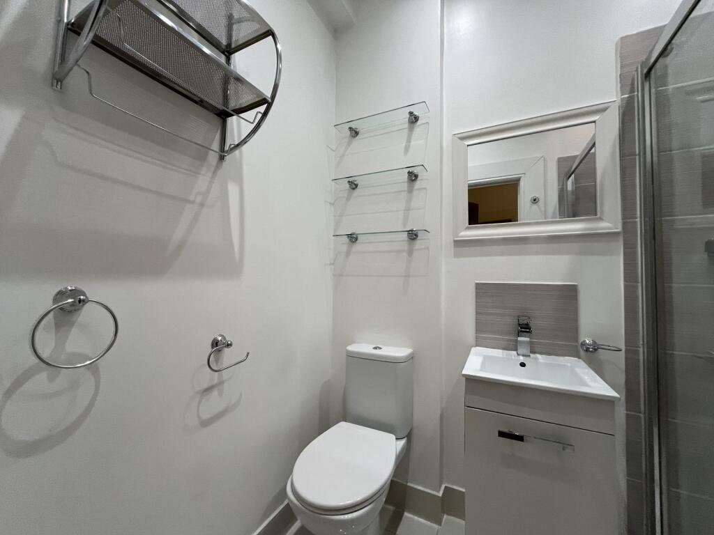 A modern, well-maintained bathroom featuring a ...