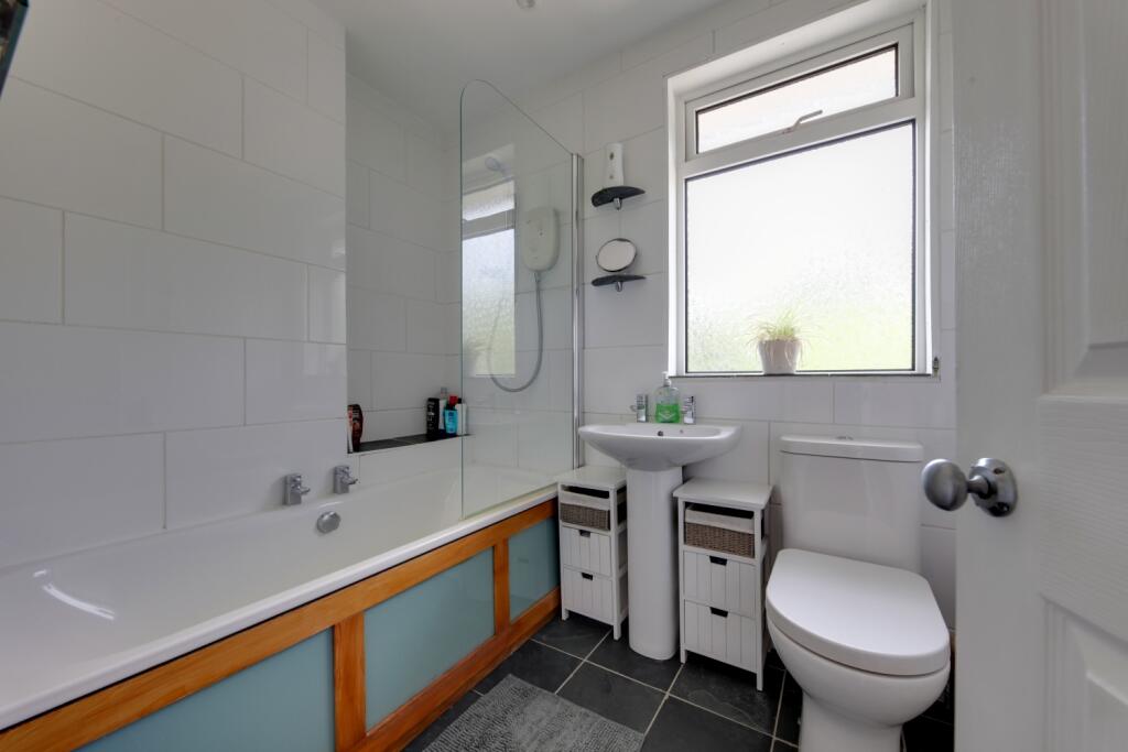 bathroom with over bath shower