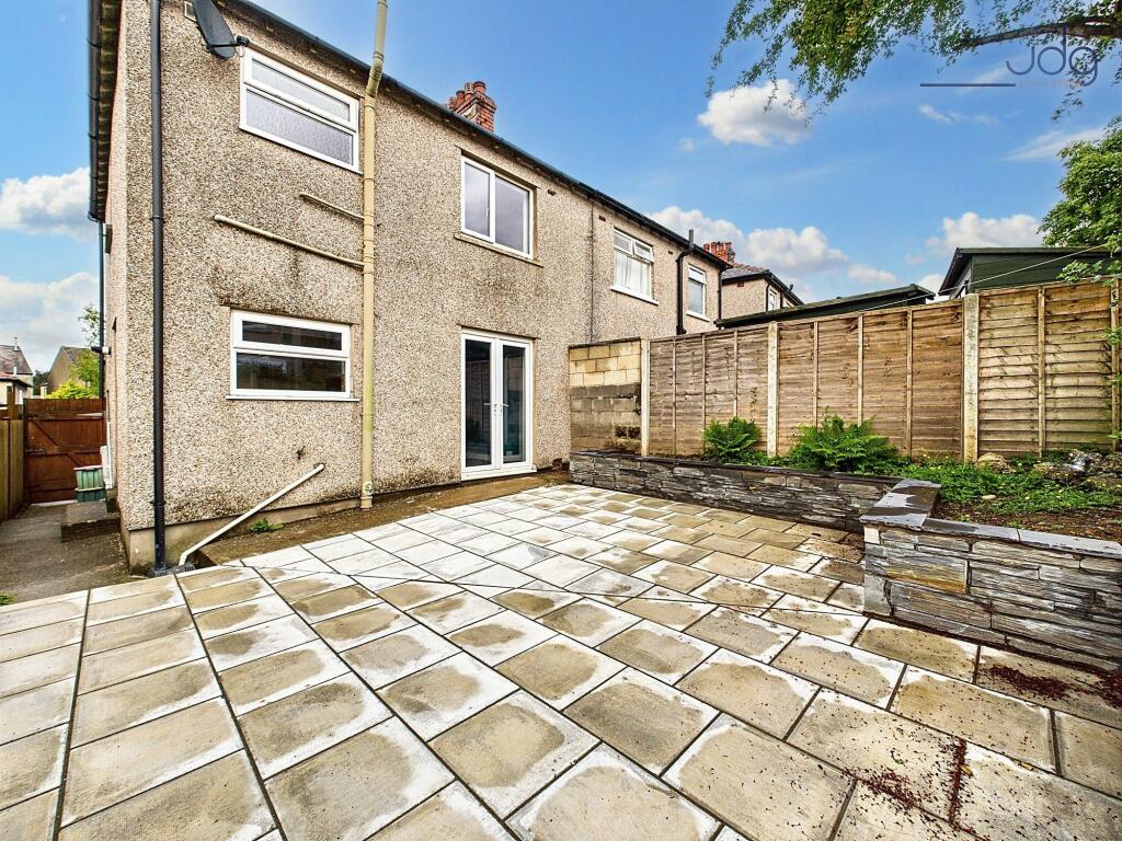 Spacious flagged Garden and raised bed, rear view