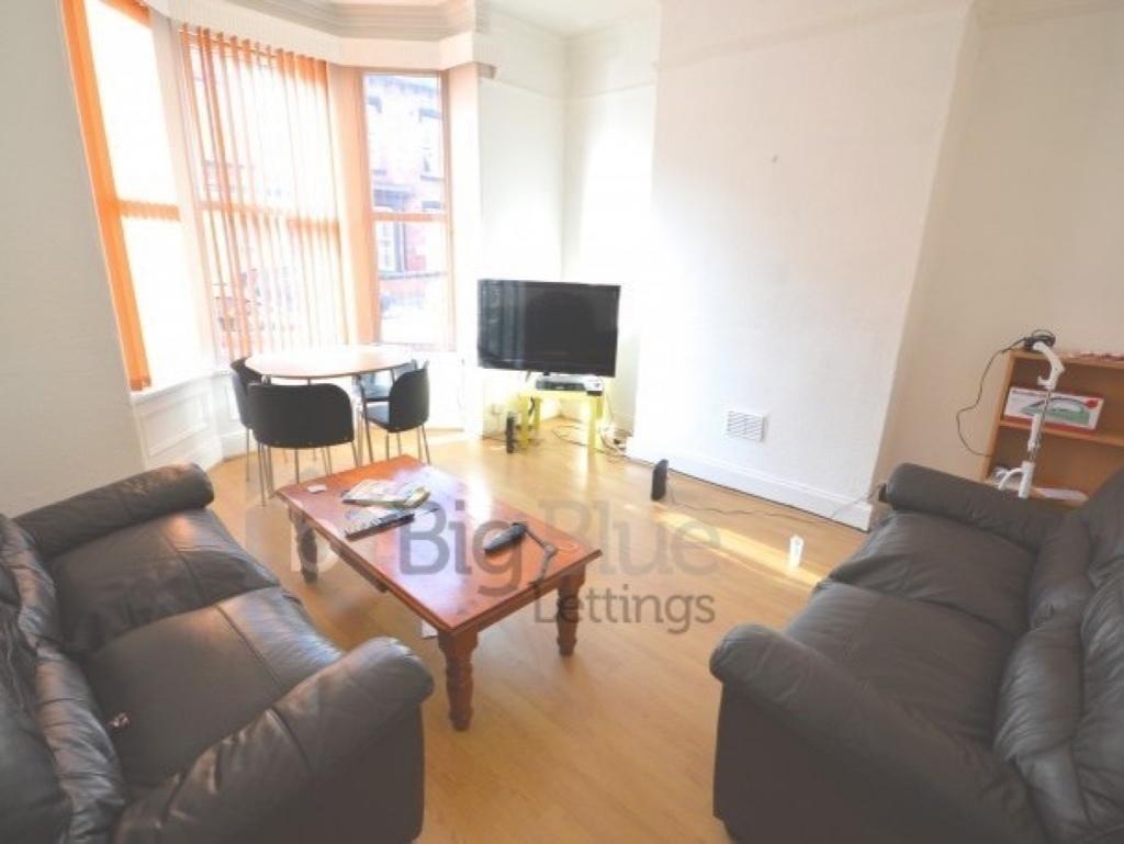 Bright and inviting living room featuring comfo...