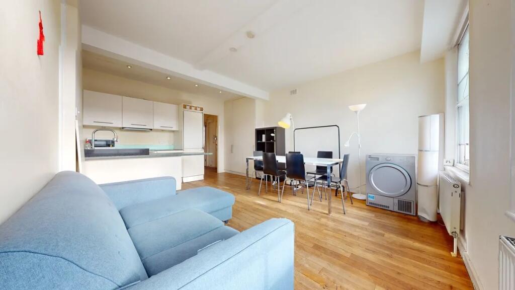 A bright and inviting living room featuring a c...