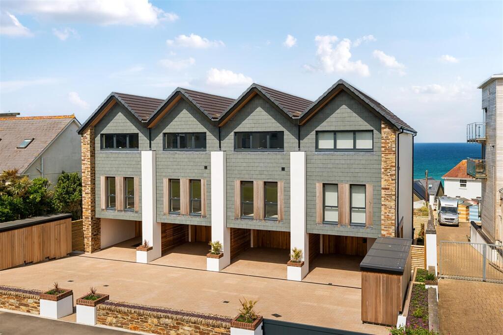 2 Undercroft parking bays and gated entrance