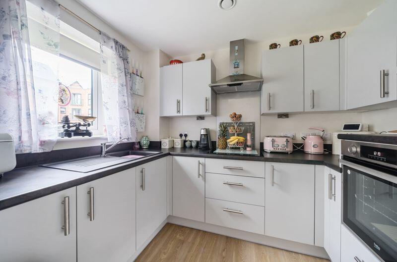 Kitchen with built-in appliances