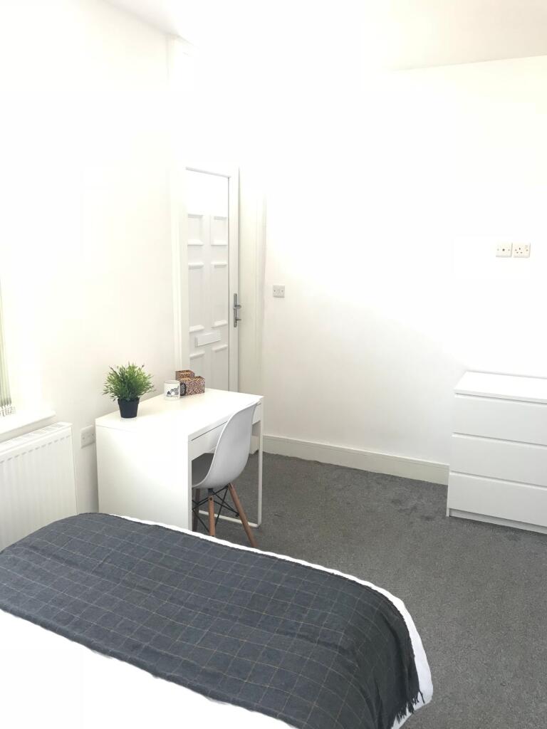 Bright and inviting double bedroom featuring a ...