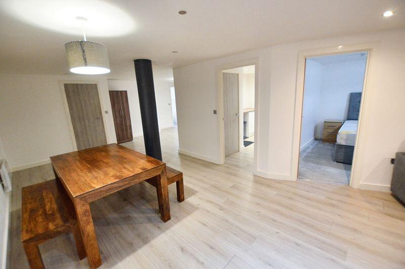 Bright and spacious living area featuring moder...