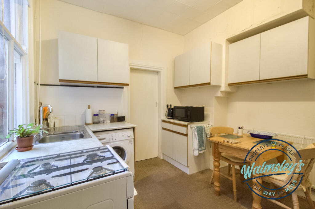 Kitchen breakfast with doorway to gardens