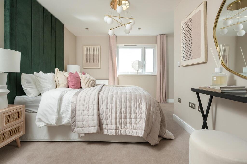 King-size bedroom with plenty of storage space and en suite shower room