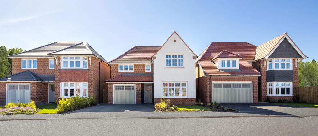Three modern detached houses with brick and white facades, with front gardens and garages, under a c