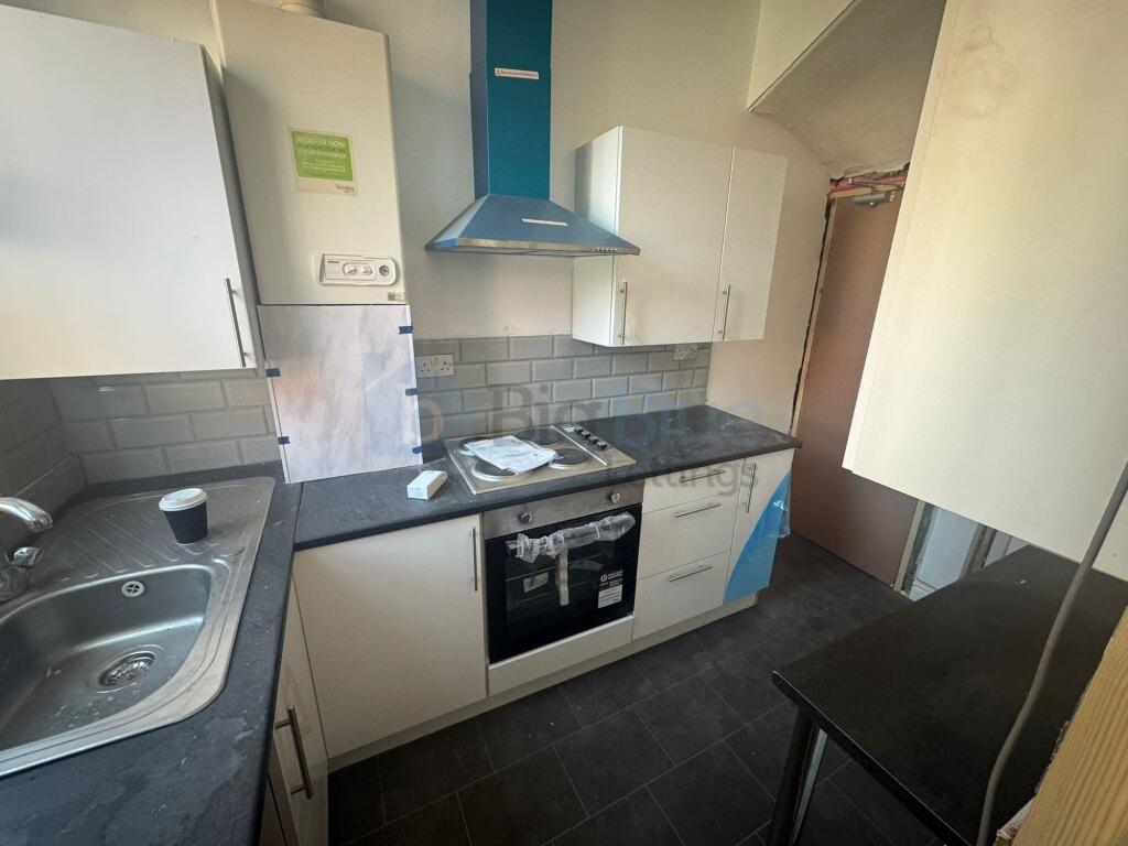 This modern kitchen features sleek cabinetry an...