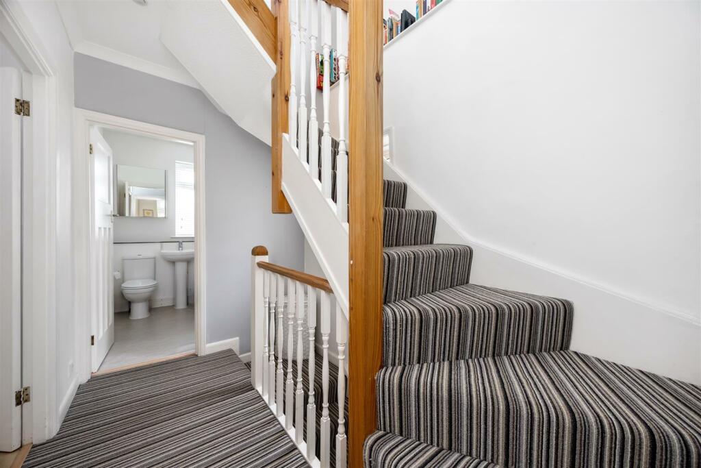 Stairs rising to Second Floor