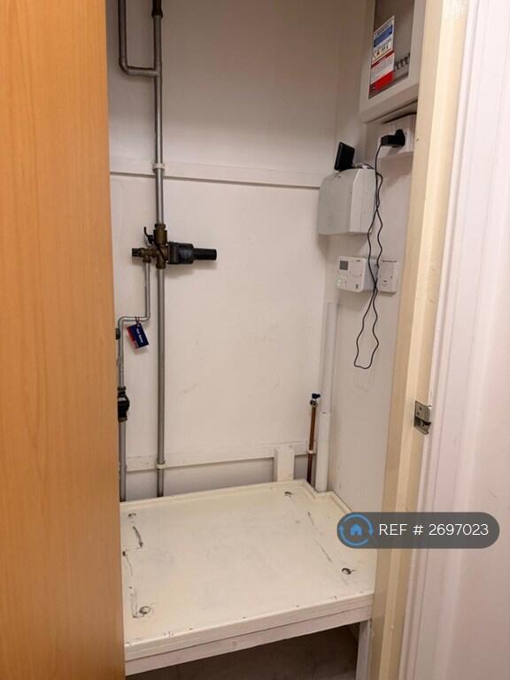 Airing Cupboard With Washing Machine Plumbing