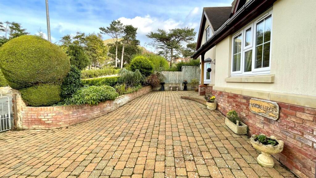 GOOD SIZED BLOCK PAVED PARKING AREA