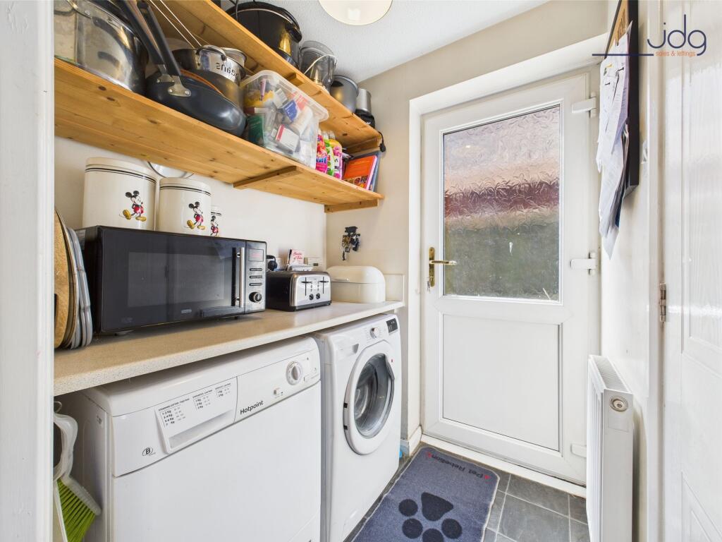 Utility space leading out to the back garden