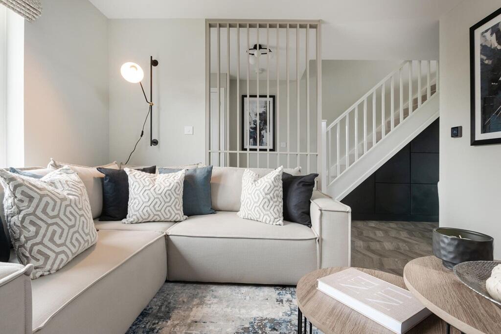 The living room is light and spacious and leads through to the kitchen/dining area