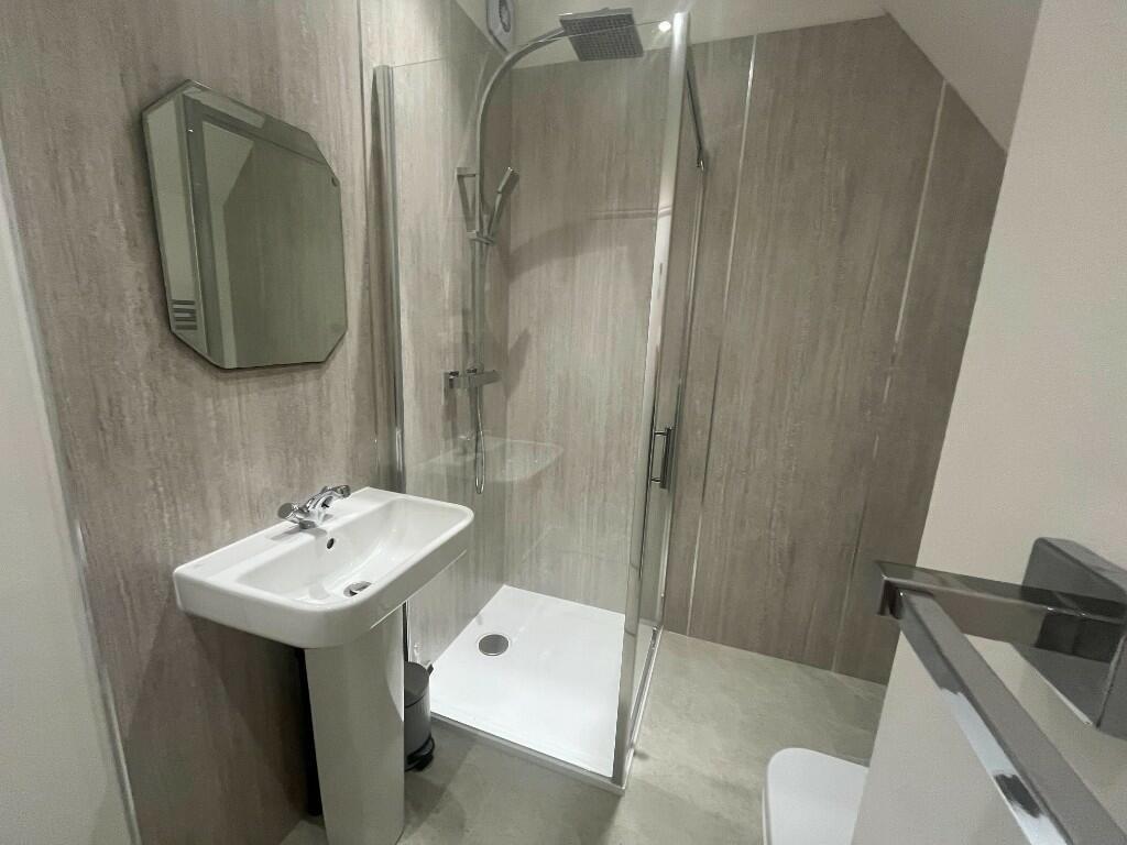 A modern bathroom featuring a clean and stylish...