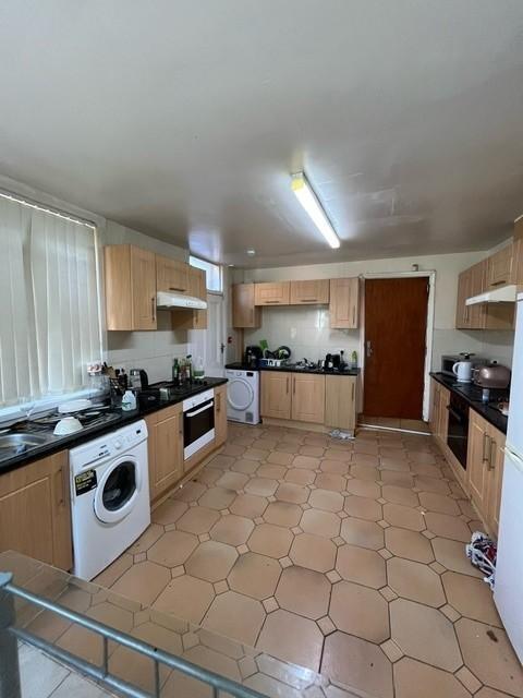 A spacious and functional kitchen with ample ca...