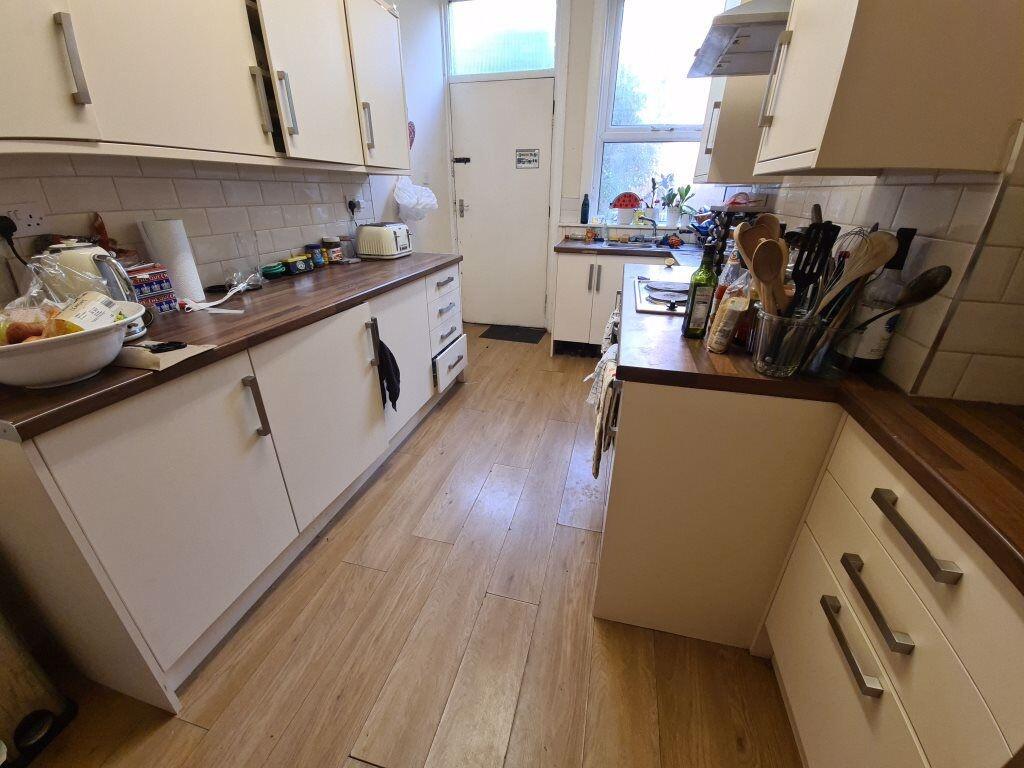 A bright, well-equipped kitchen featuring ample...