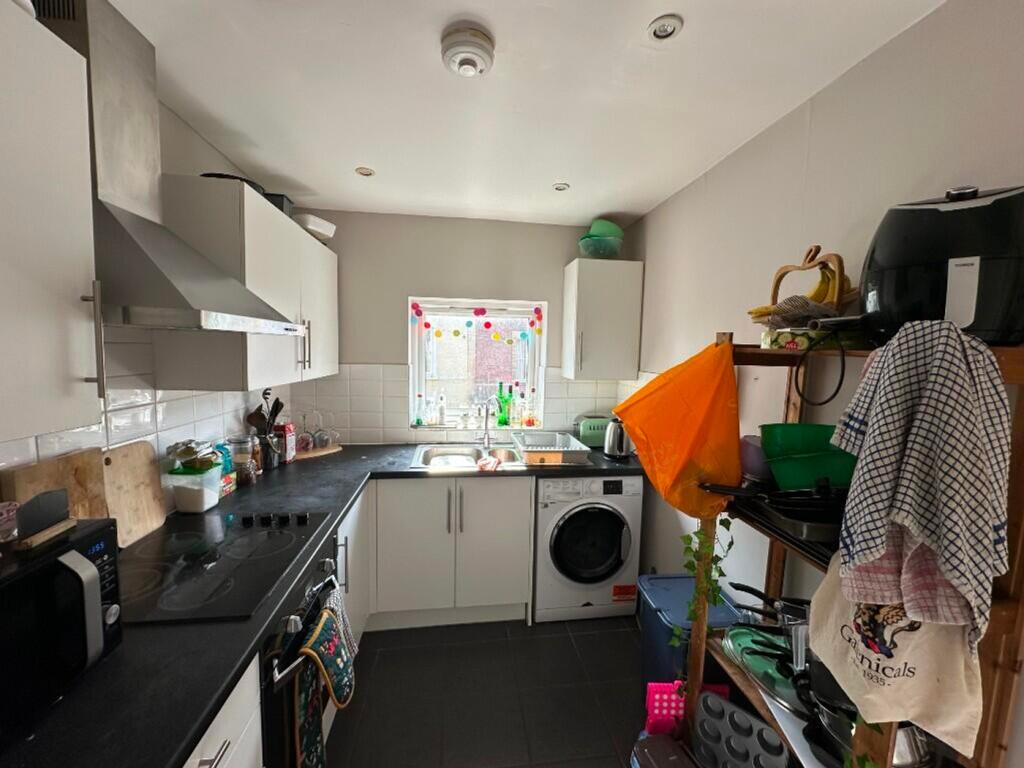 A bright and functional kitchen featuring moder...