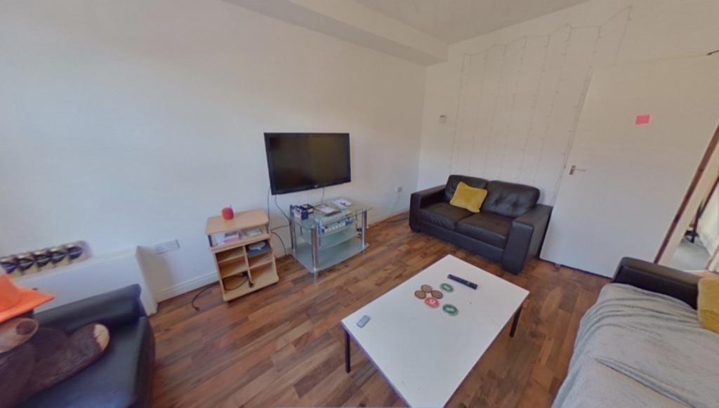 Bright and inviting living room featuring comfo...