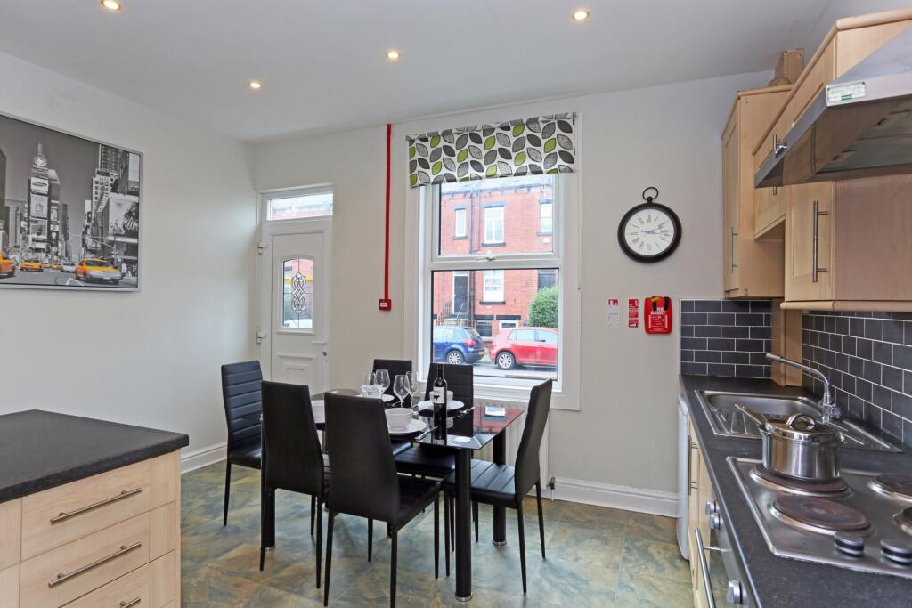 Bright and modern kitchen featuring ample count...