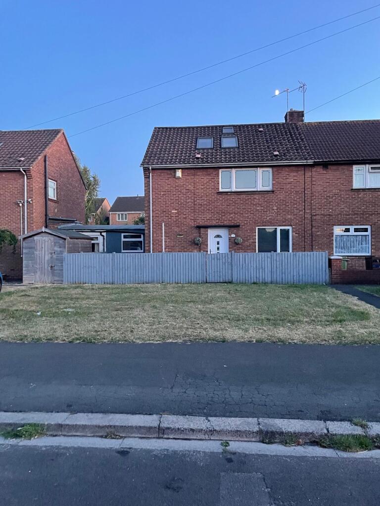 A charming semi-detached brick house with a wel...