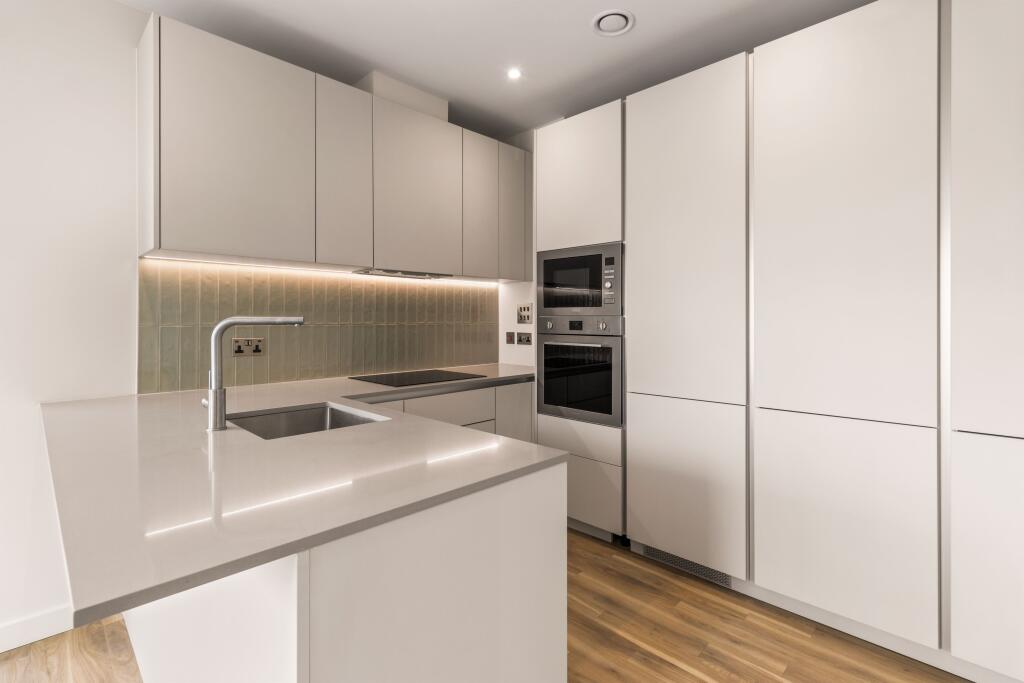 Experience culinary luxury in this sleek modern kitchen designed for style and efficiency.
