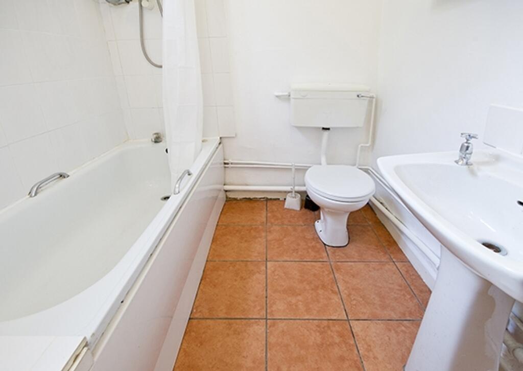 A clean and functional bathroom featuring a bat...