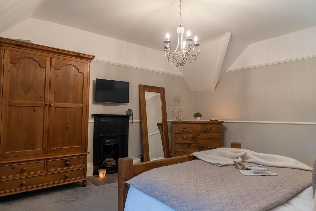 Original feature fire place in the master bedroom