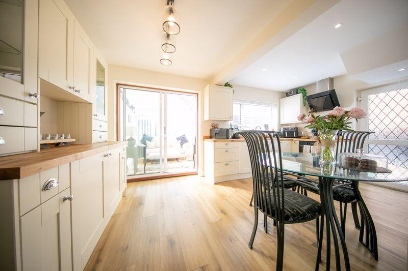 Dining area, kitchen and sun lounge