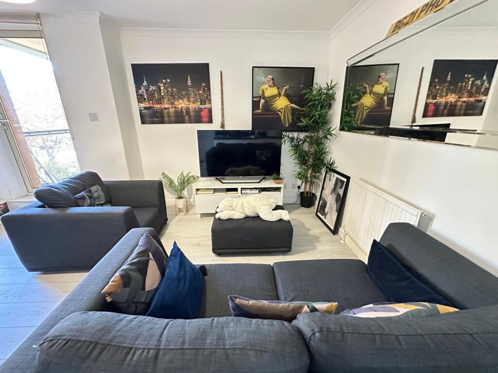 A bright and modern living room featuring styli...