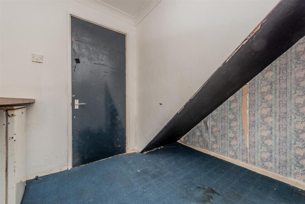 Utility Area / Storage Cupboard: