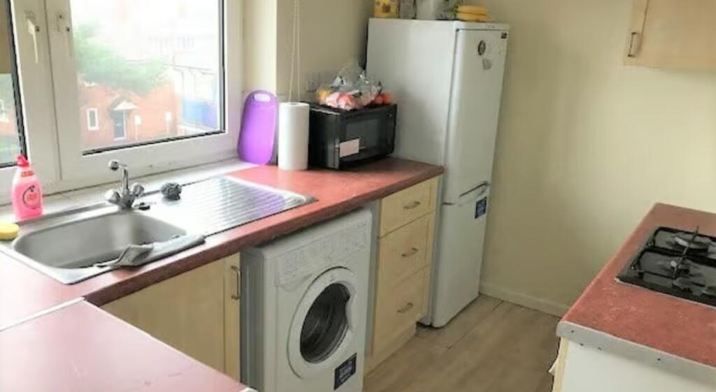 Bright and functional kitchen space featuring a...