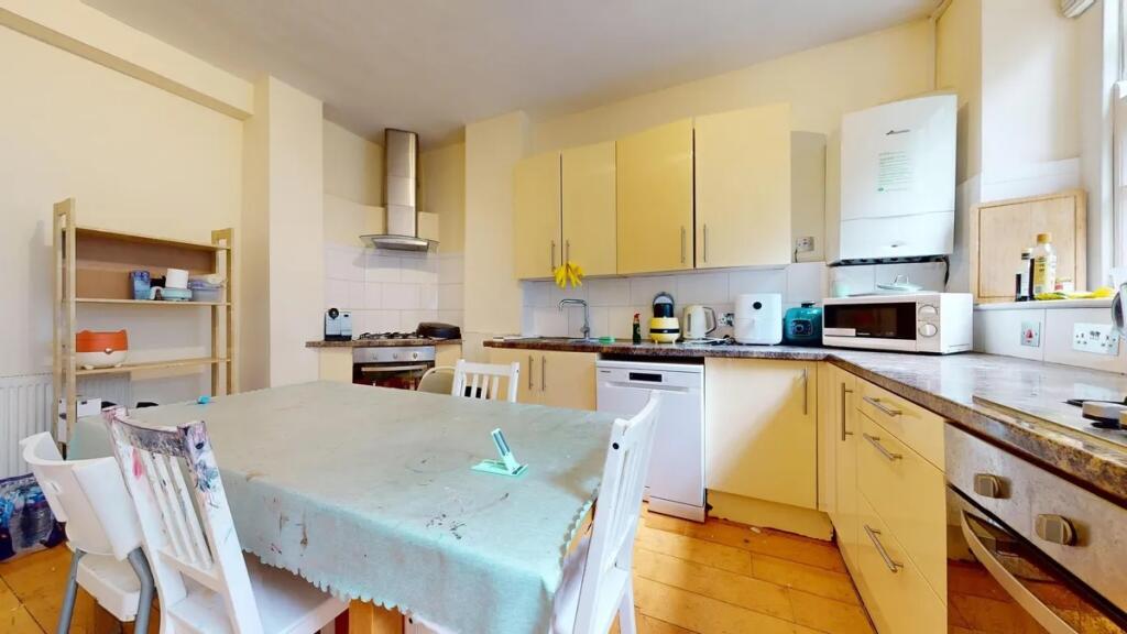 Bright and functional kitchen featuring a large...