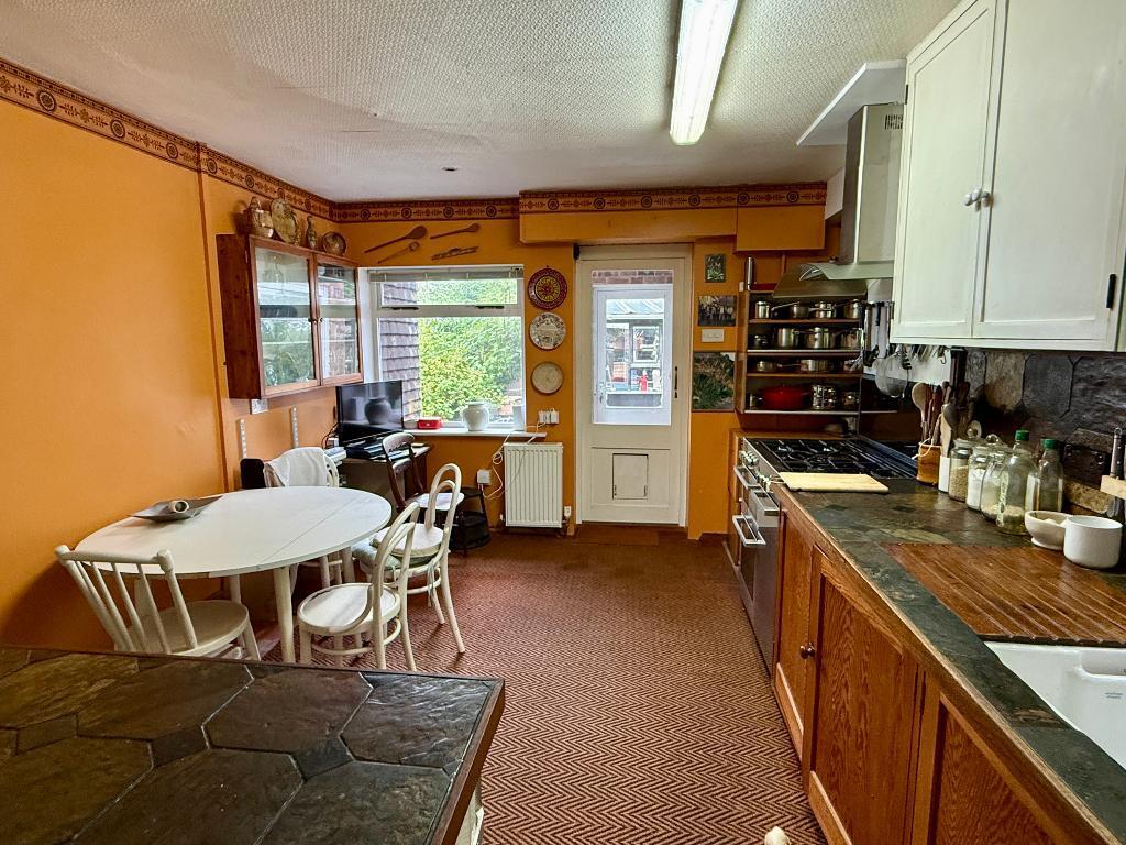 Kitchen, small utility area and larder