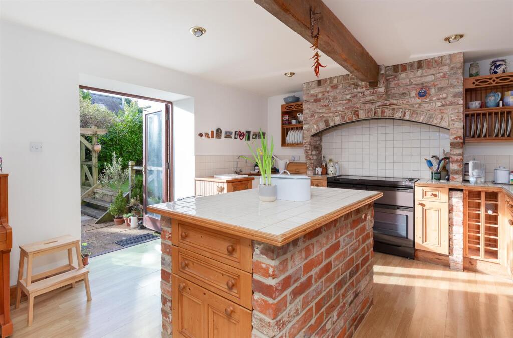 Kitchen opening to terrace