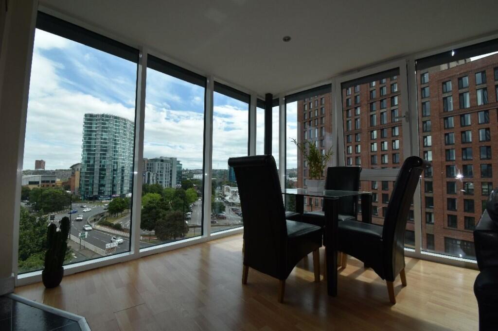 Bright and modern living room featuring floor-t...