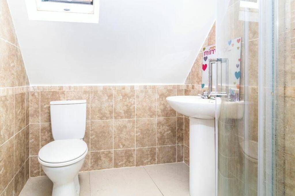 A clean and tidy bathroom featuring modern fixt...