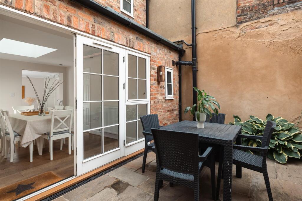 Dining Room opening into Courtyard