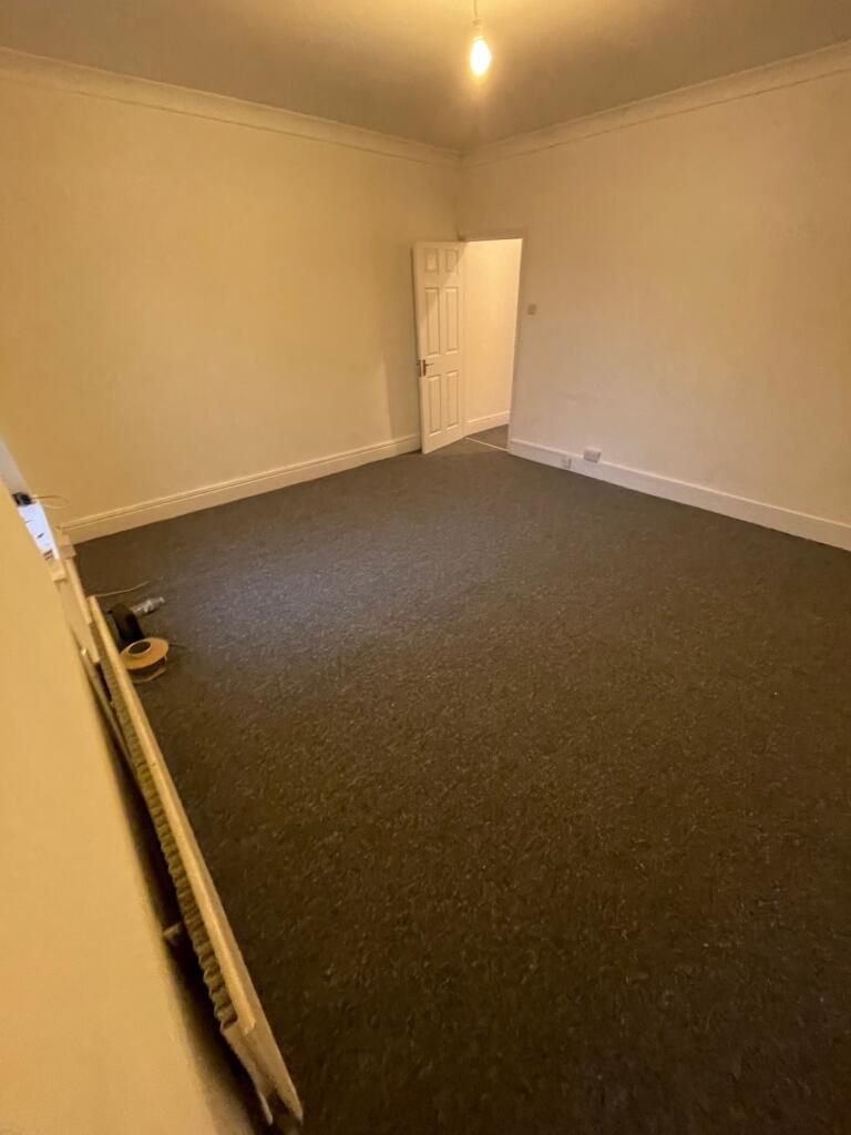 A spacious living room with potential for a coz...