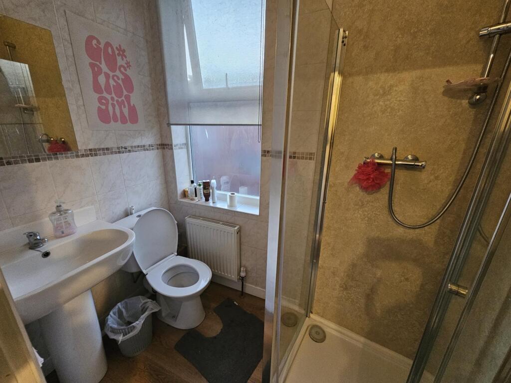 Bright, modern bathroom with a separate shower ...