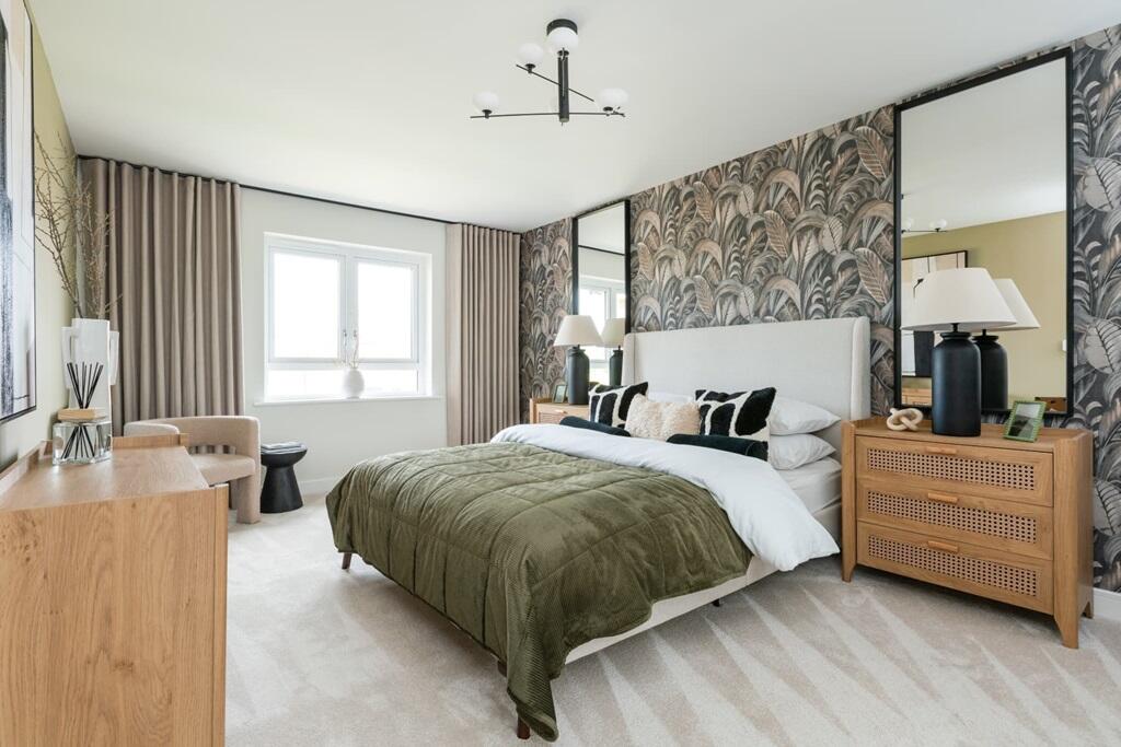 Bedroom 1 stretches across the whole depth of the house