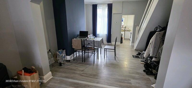 A bright and modern living room featuring wood-...