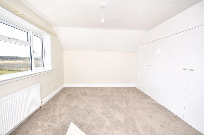 Bedroom two with fitted wardrobes