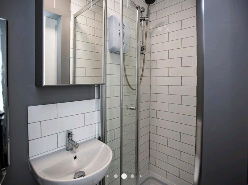 Bright and modern bathroom featuring a clean wh...