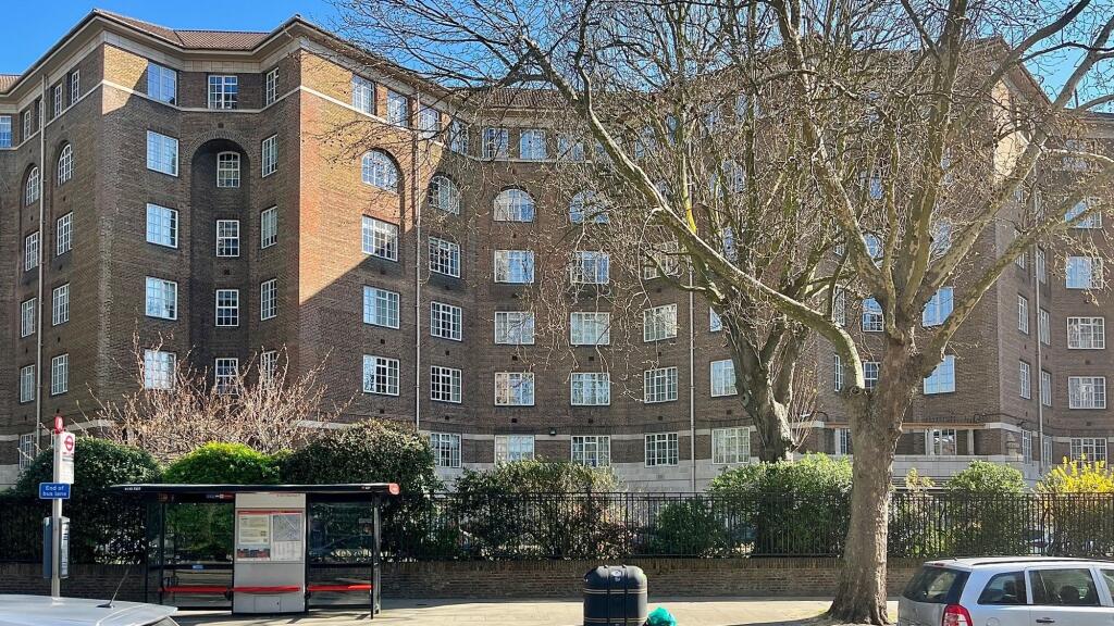 A well-maintained front view of a classic brick...