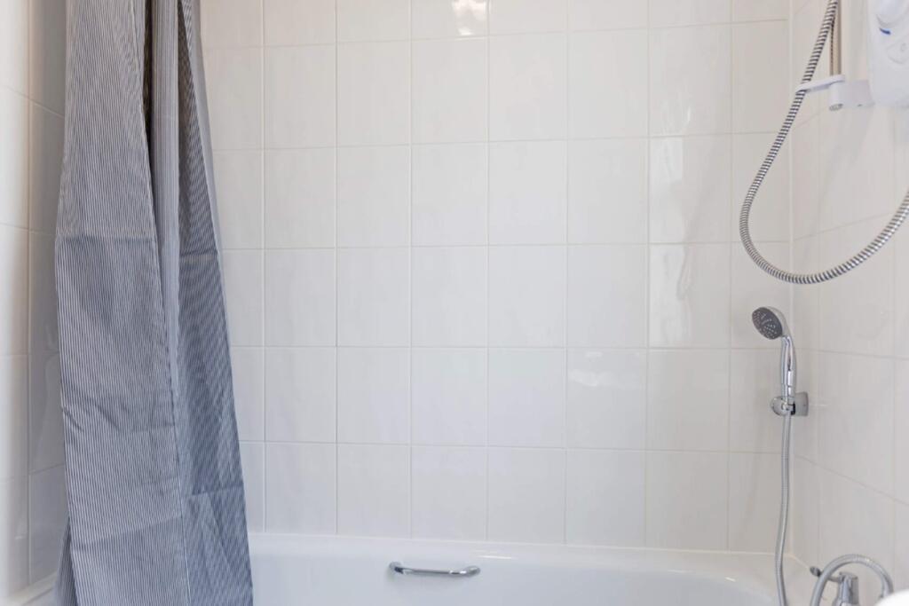 A bright and immaculate large bathroom featurin...
