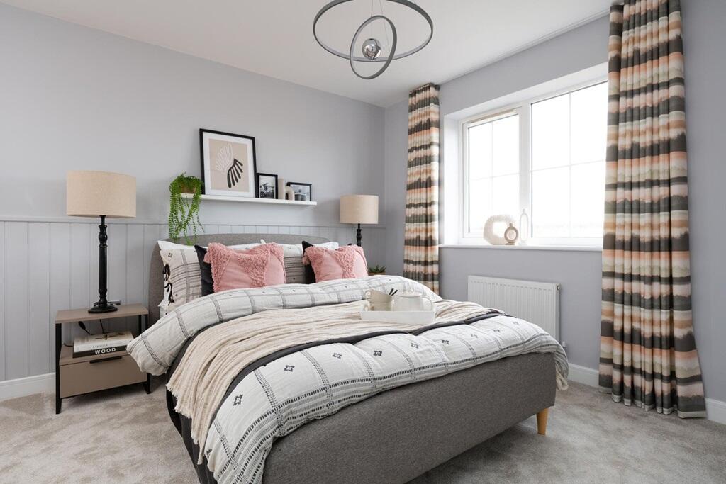 Windows in bedroom 2 flood the room with natural light